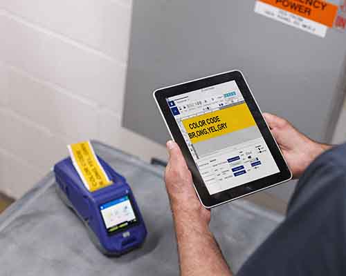 Label printing on the M611 with a preview shown in the Express Labels mobile app on a tablet.