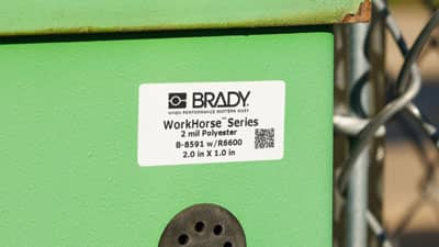 A Brady all-weather polyester label applied to an outdoor electrical service box.