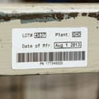A barcode label applied to warehouse shelf to identify the items stored there.