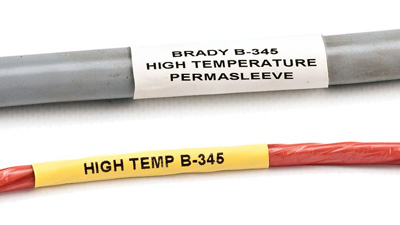 A gray cable with a white Permasleeve label and a red wire with a yellow Permasleeve label.