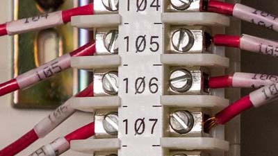 Eight red wires identified with a white terminal block label and individual wrap around labels.